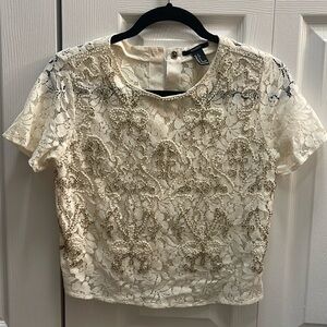 Forever 21 cream embellished with pearls and beads made out of lace material